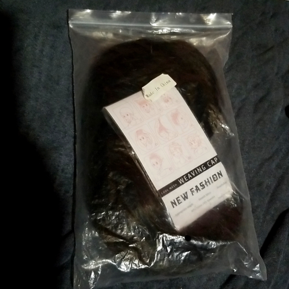 Dark colored wig with mesh weaving cap